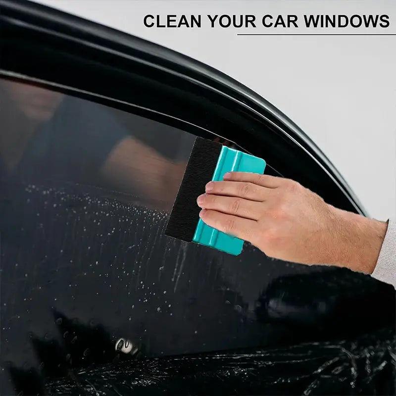 Felt-edge squeegee for window tinting by Simples Market, blue-green plastic scraper for car wrap.
