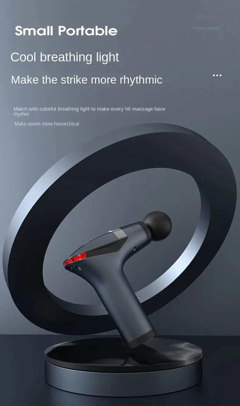 Long-handle electric massage gun by Simples Market on display stand; dark gray body with black head