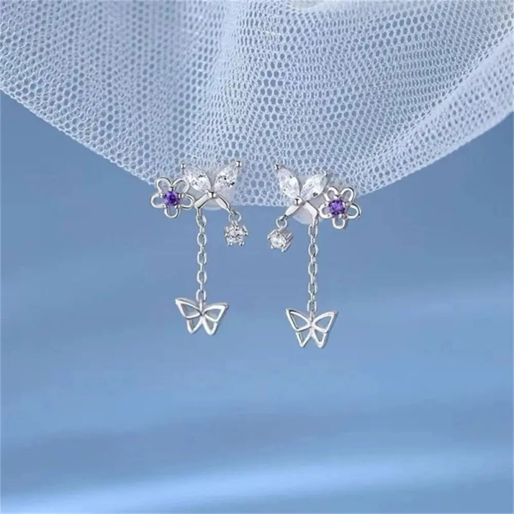 Simples Market moon butterfly crystal tassel drop earrings pair in silver-tone with butterfly charms