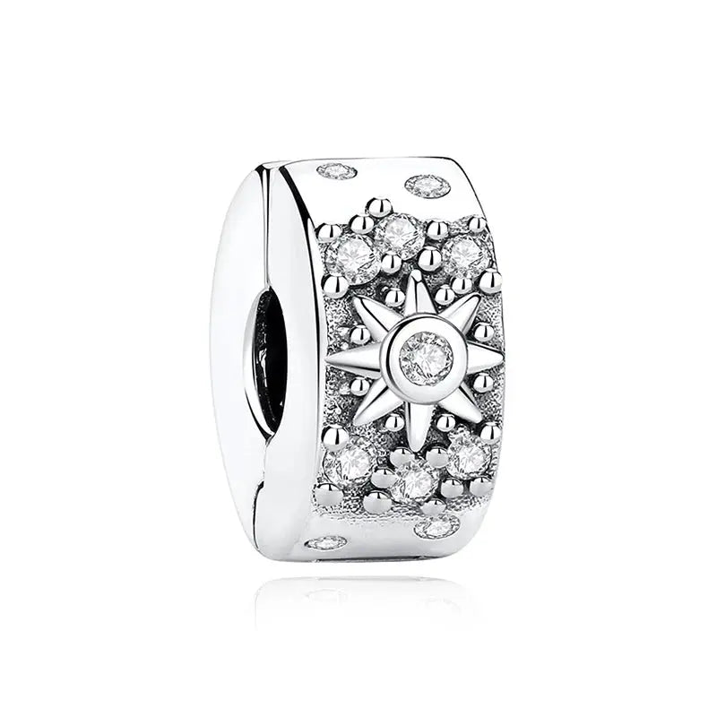 Sterling silver bracelet charm bead by Simples Market with a star sun motif and zircon crystals