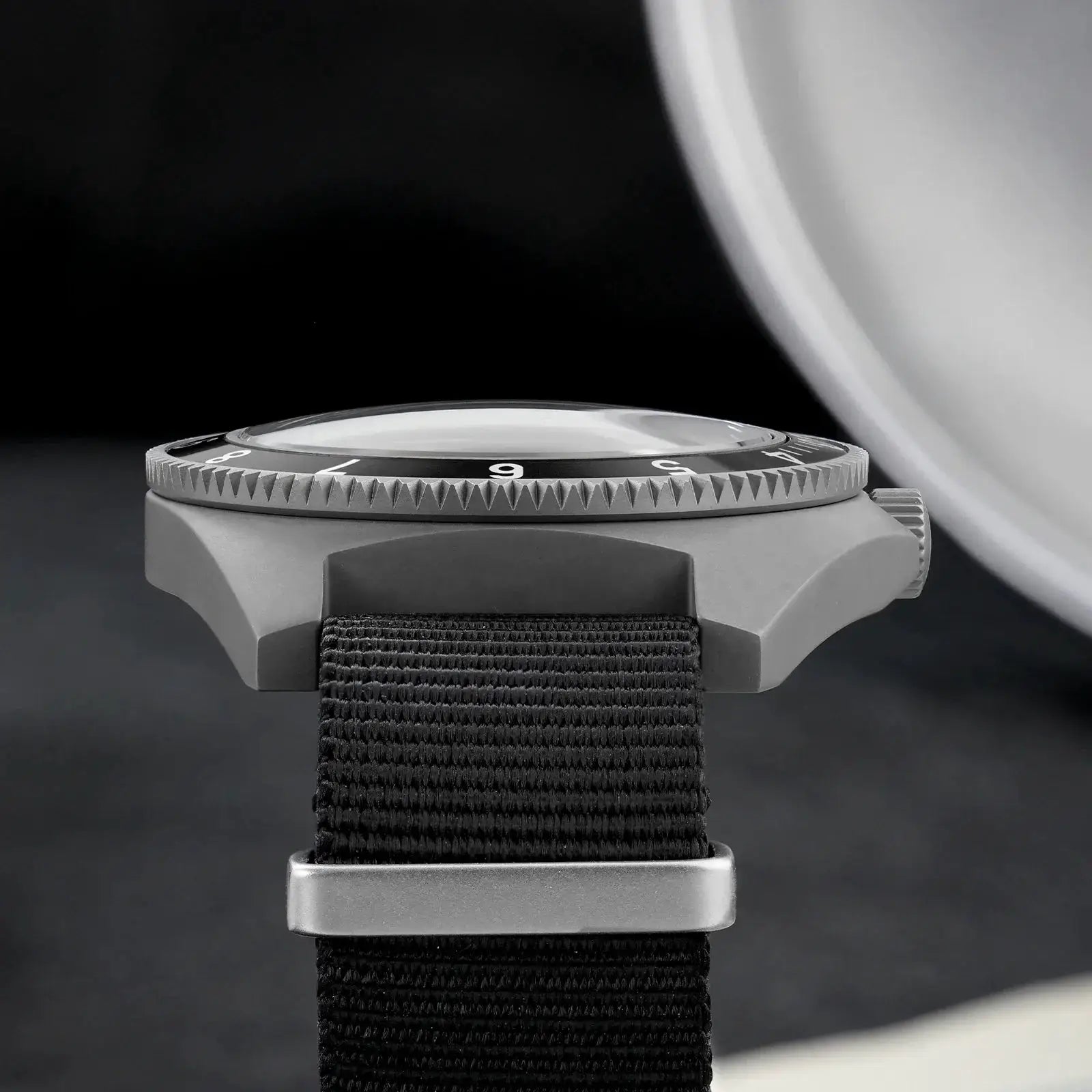 Watchdives WD1972 quartz watch with black bezel, gray case, and fabric strap