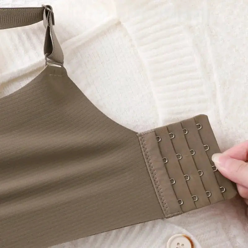 Push-up bra with wide straps in beige; back hook closure
