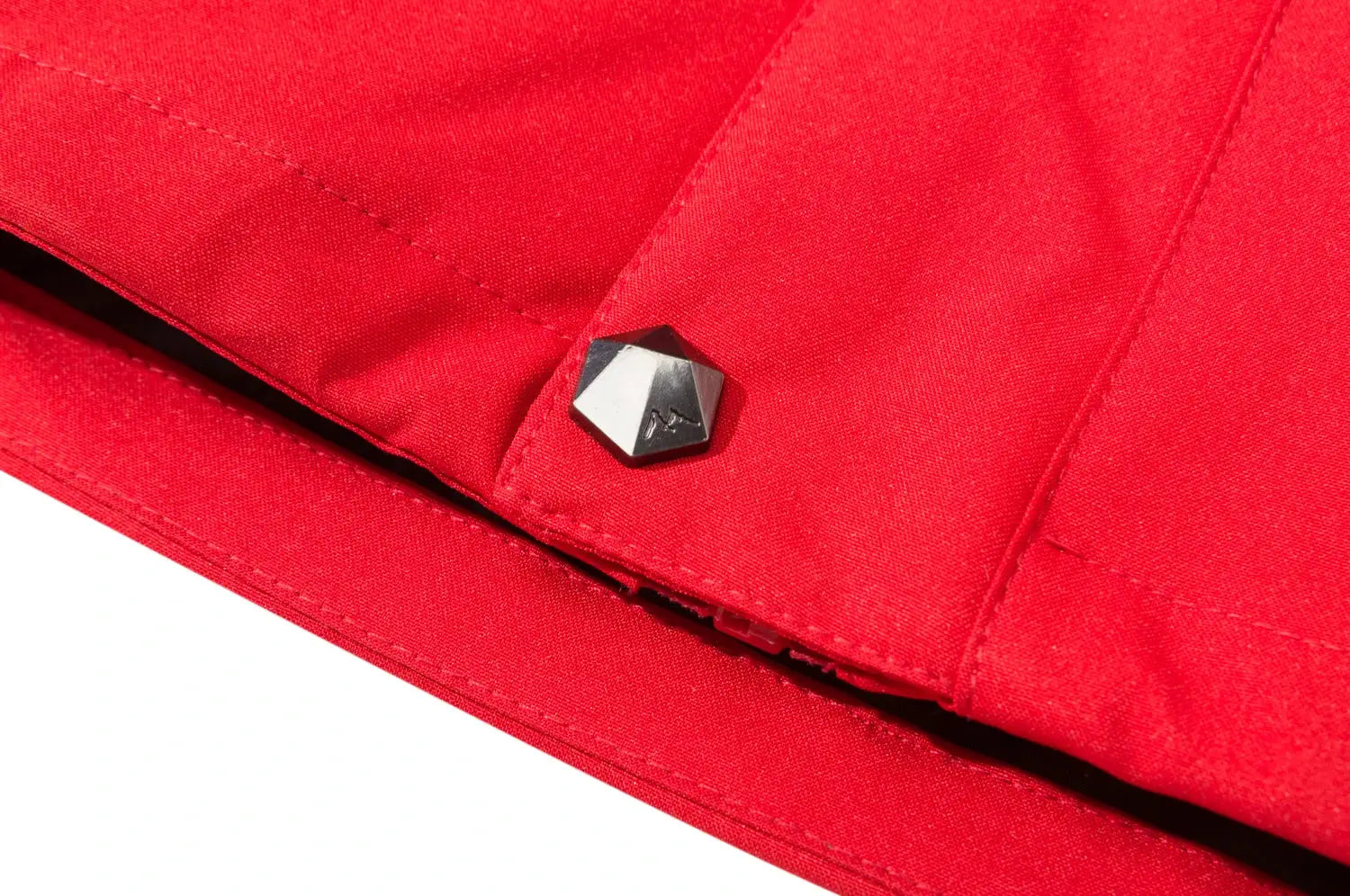 Men's red outdoor jacket with metal hex snap button detail