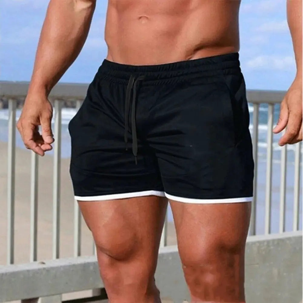 Men's black gym shorts with white trim, drawstring waistband, breathable mesh fabric.