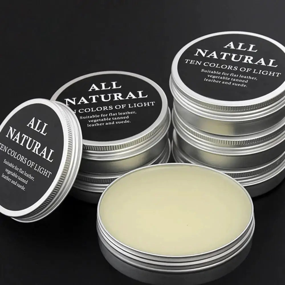 Leather care cream tins, five metal containers with beige cream and all-natural labels