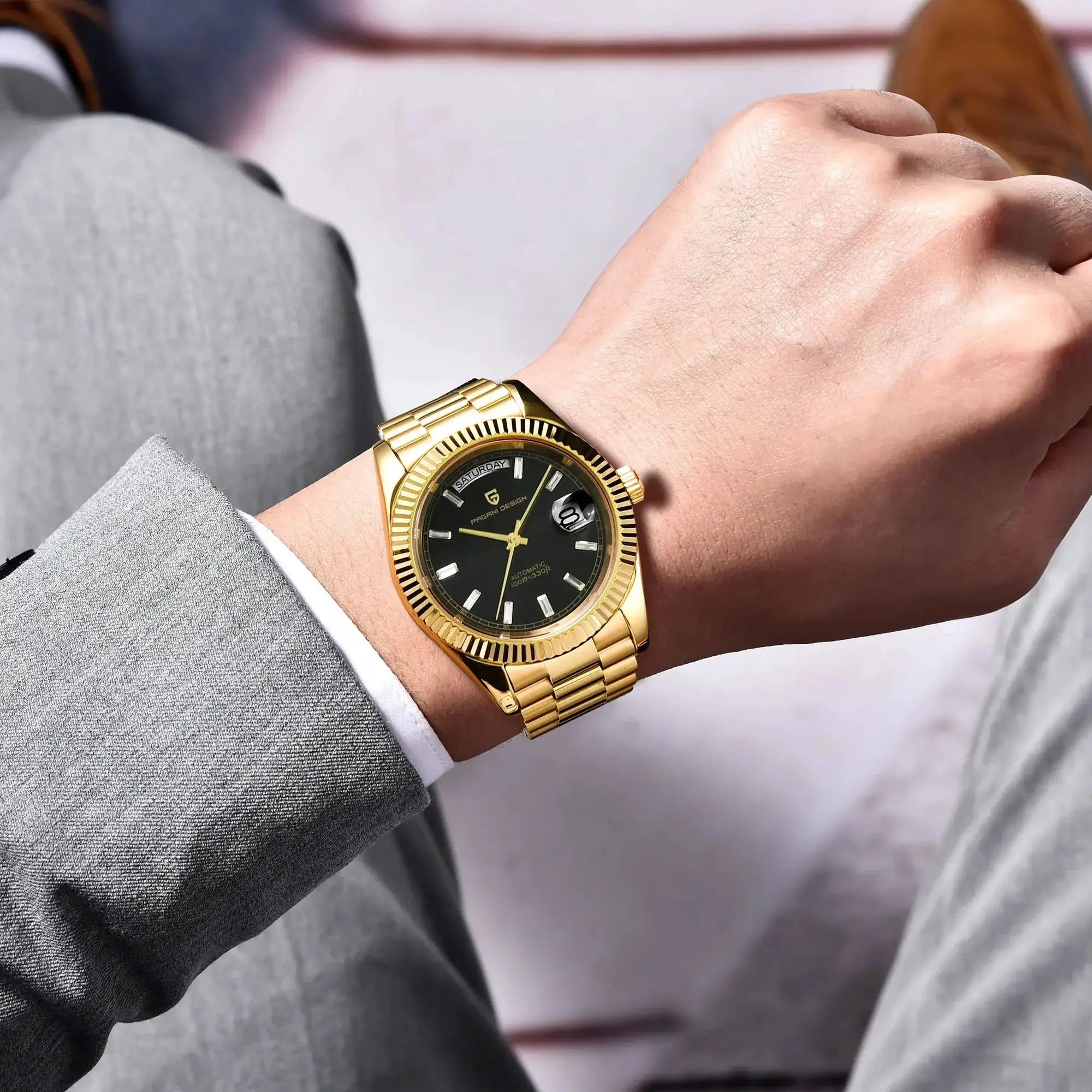 Pagani Design gold-tone 40mm men's watch with black dial and day-date display, metal bracelet