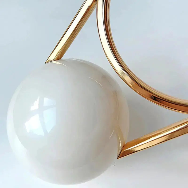 Ball-handle acrylic evening clutch, white handbag with gold-tone frame by Simples Market