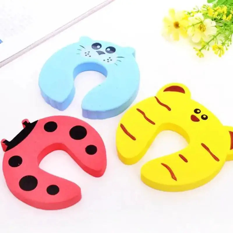 Simples Market 3-pack cartoon animal baby safety door stoppers in blue cat, pink ladybug, yellow tiger