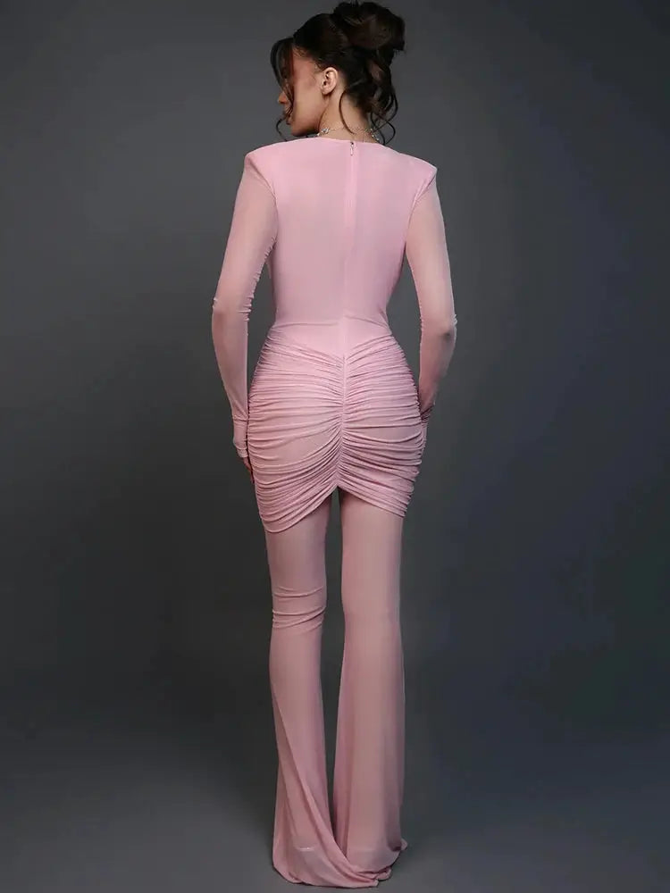 Mozision pink long-sleeve ruched back jumpsuit with flared legs, clubwear style