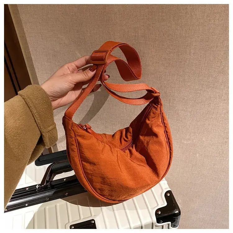 Casual nylon hobo crossbody bag in orange with adjustable strap