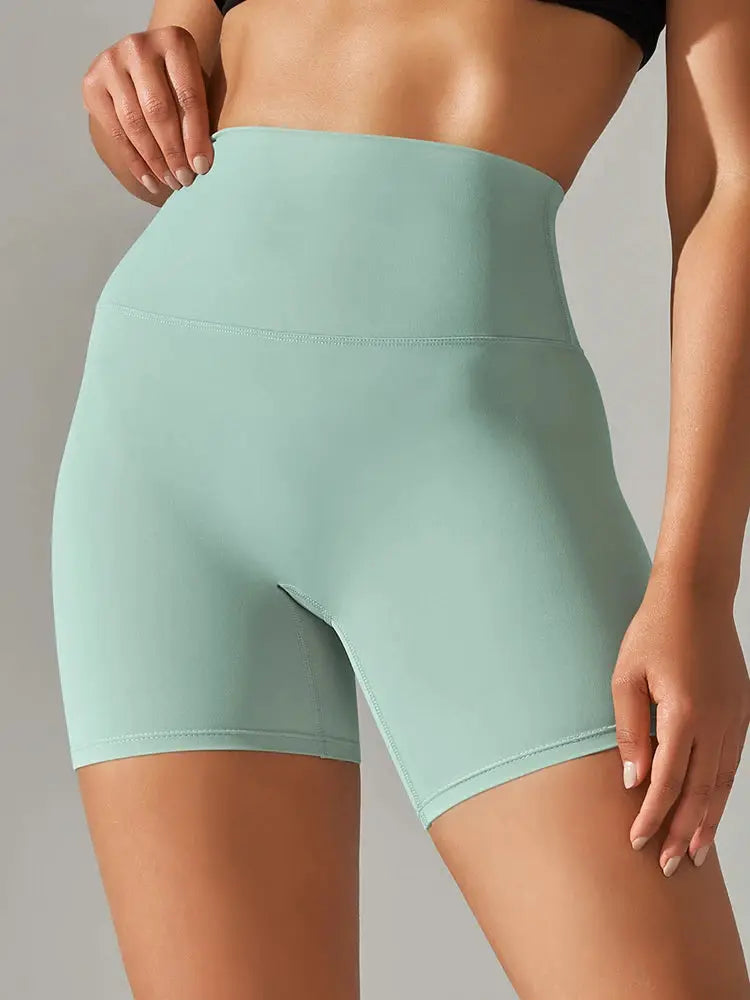 Women’s mint green high-waisted yoga legging shorts for workouts