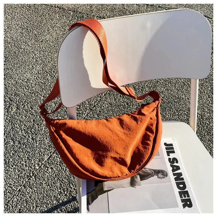 Casual nylon hobo crossbody bag by Simples Market in burnt orange with long strap