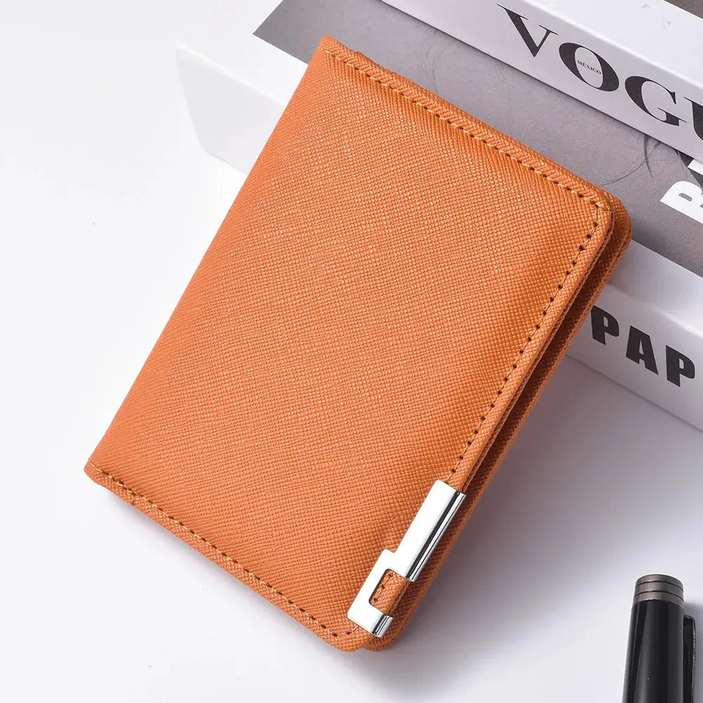 Small slim business-style wallet by Simples Market in orange faux-leather with a silver geometric clasp