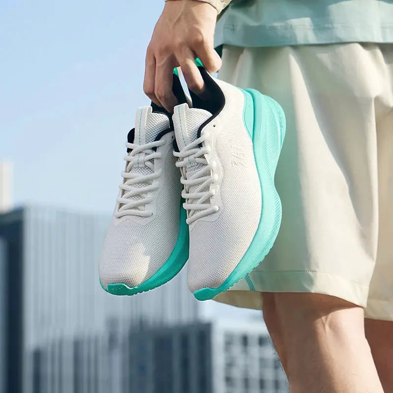 Pair of 361 Degrees Fengye 5.0 running shoes, white mesh uppers with turquoise soles