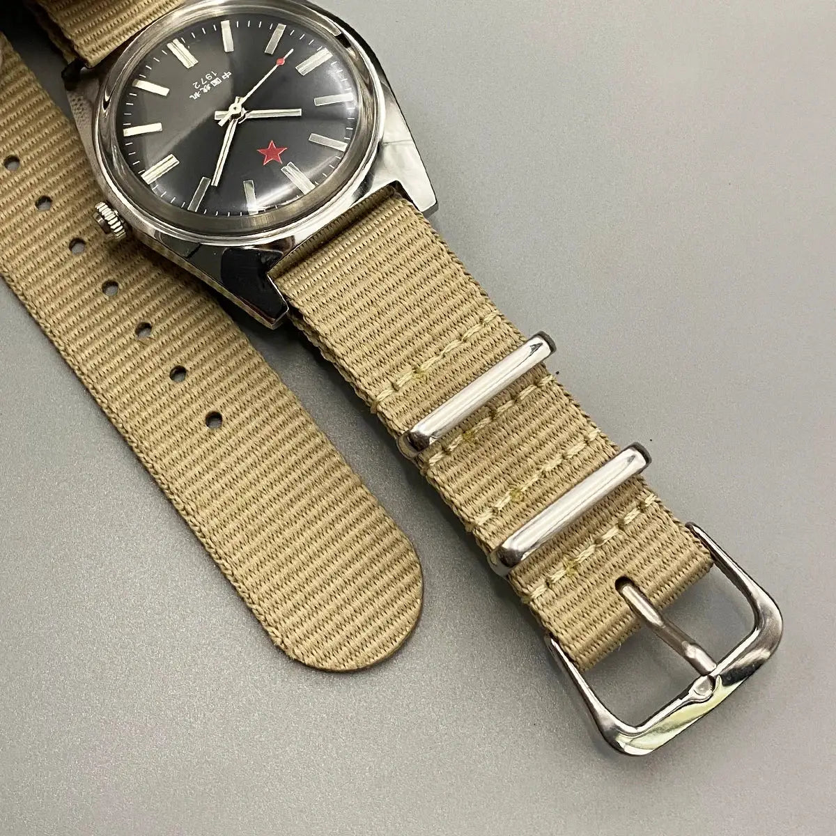 Men's mechanical Shanghai 8120 watch with black dial, red star, silver case, beige nylon NATO strap