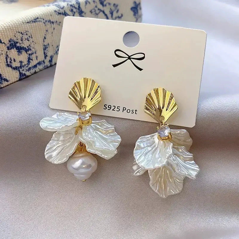Exaggeration Ocean Style Shell Texture Earrings pair, gold-tone shell tops with white iridescent petals and pearl drops