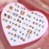 36-pair resin stud earrings set featuring snowflake, cat and butterfly designs in a pink heart display by Simples Market