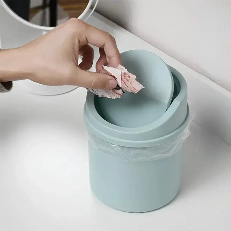Mini desktop trash can with cover in pastel blue plastic, Simples Market desk bin.