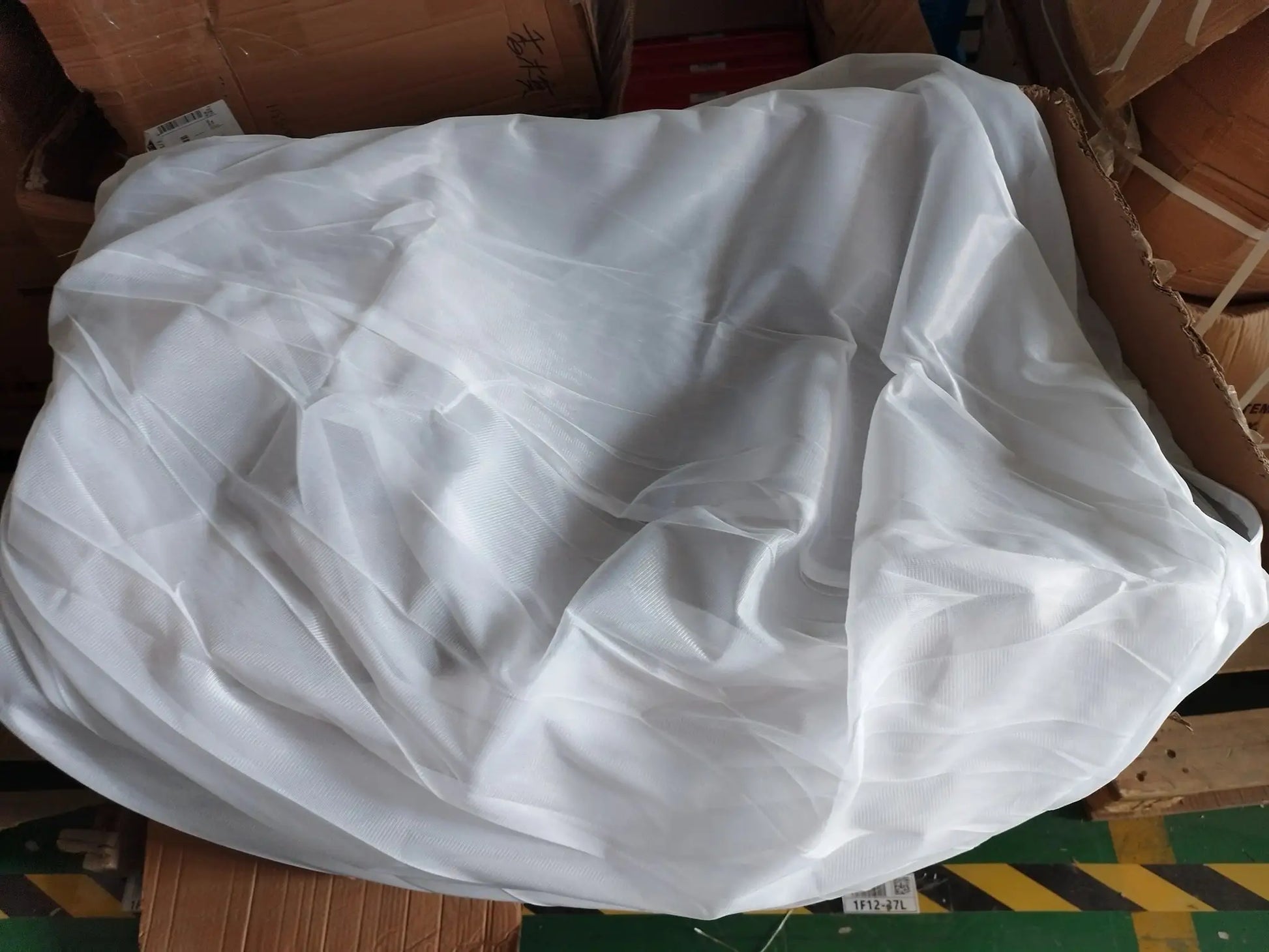 White linen sofa cover for large bean bag lounger, crumpled fabric in box