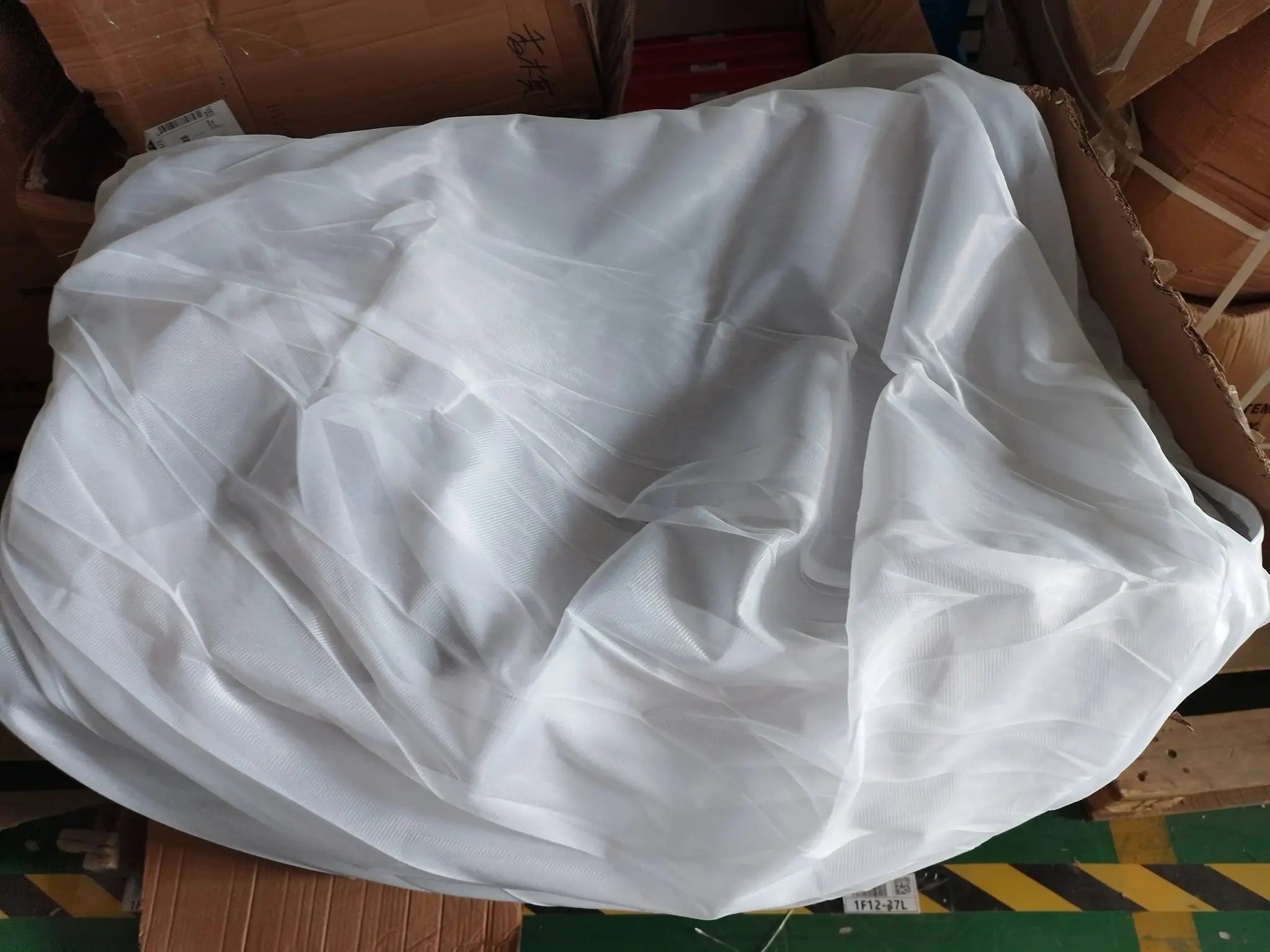 White linen sofa cover for large bean bag lounger, crumpled fabric in box