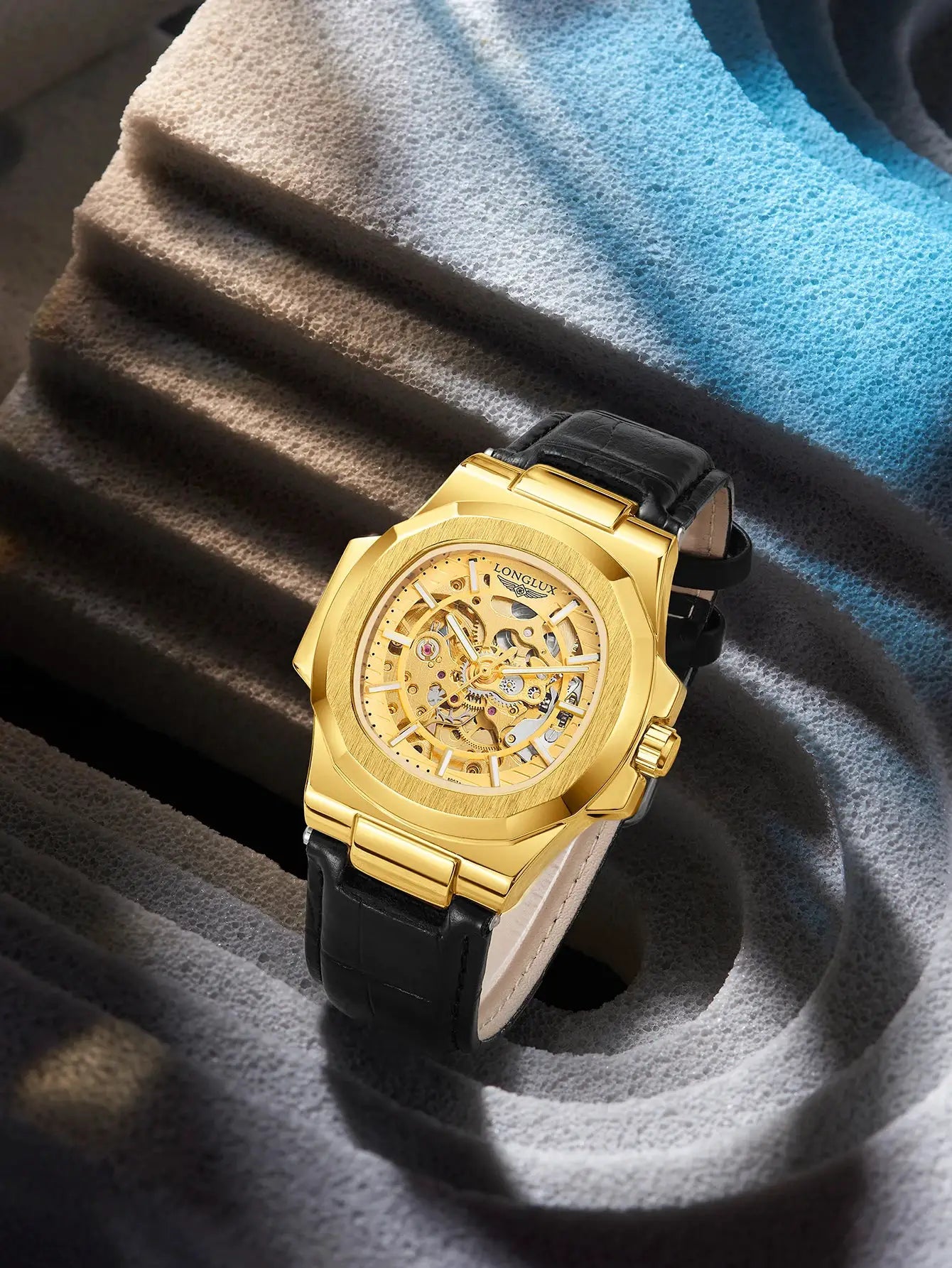 Men's gold skeleton automatic wristwatch with black leather strap