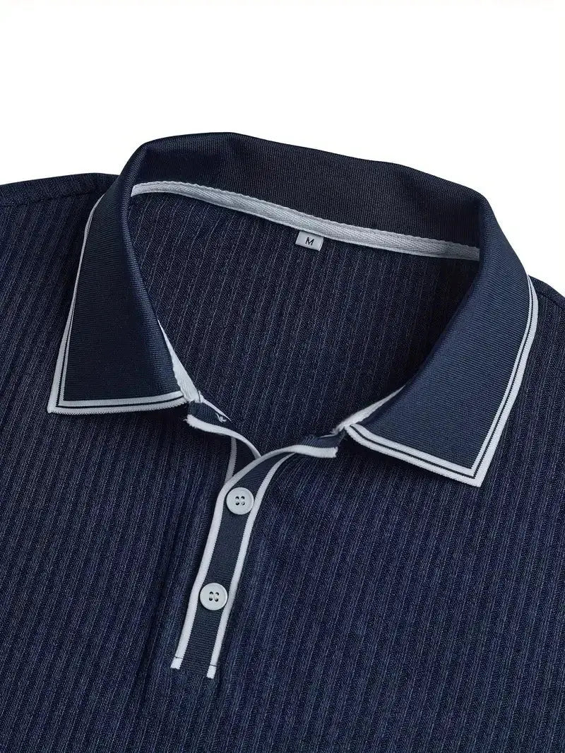 Men's navy polo shirt with white piping on collar and placket, short sleeves.
