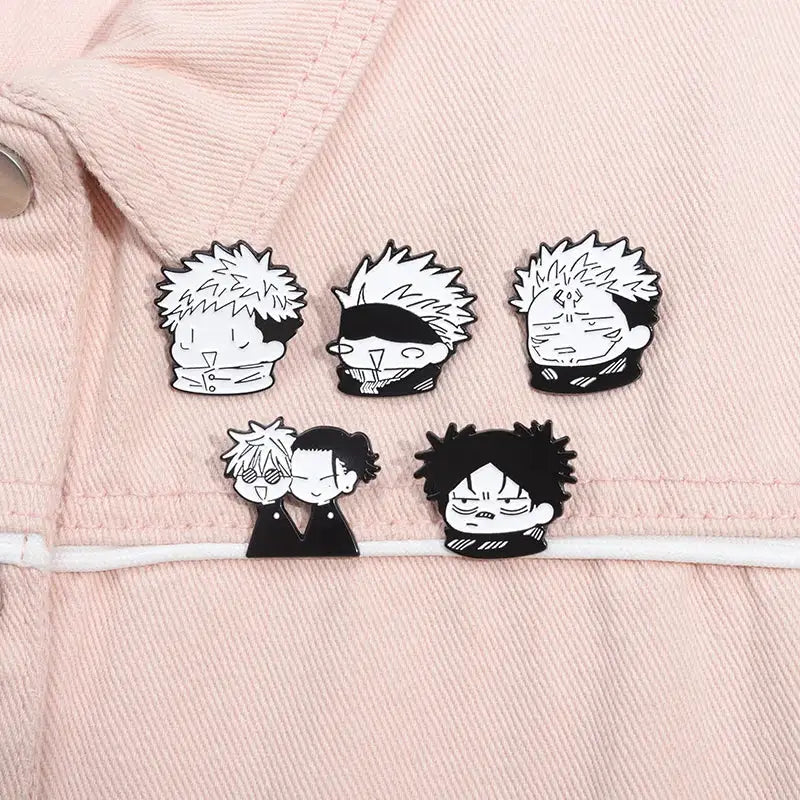 Cartoon anime enamel pins on pink jacket; five black-and-white Q-Version brooches featuring spiky-haired faces and a couple pin