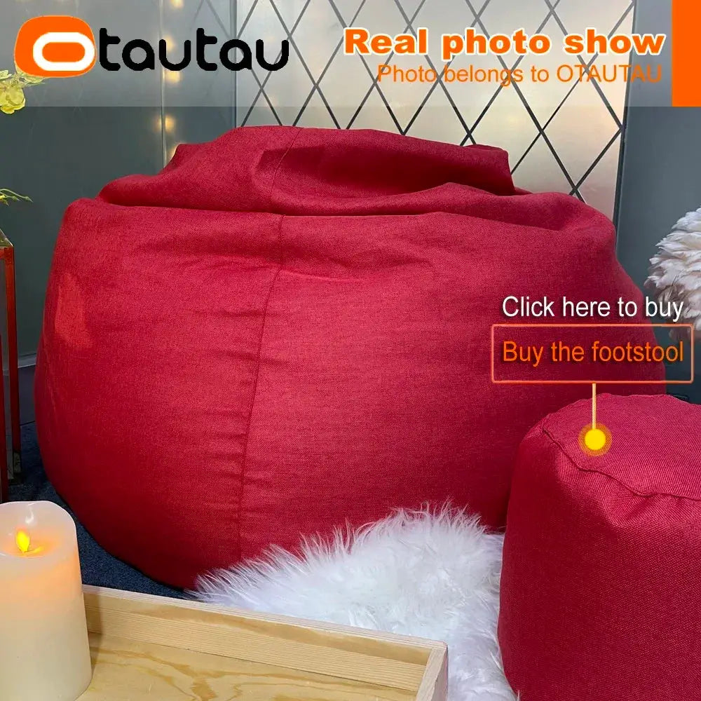 Two red cotton-linen bean bags, a large sofa-style bean bag and a smaller red bean bag, in a cozy bedroom setup.