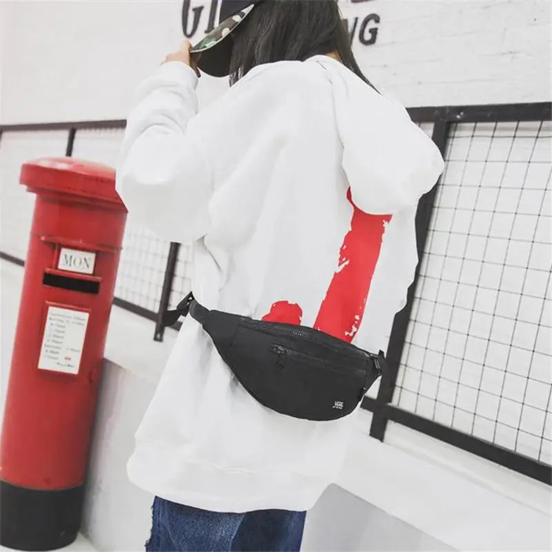 Fanny pack waist bag in black by Simples Market worn at the hip