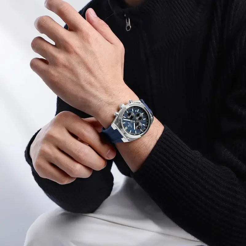 NAVIFORCE men's chronograph watch with blue dial and blue silicone strap on the wrist; stainless steel case.