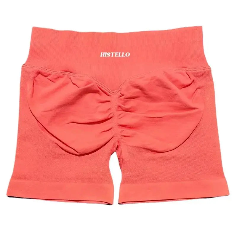 HISTELLO women's coral pink sports shorts, low-waist seamless scrunch back, breathable stretch fabric