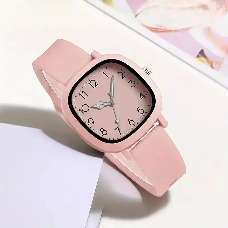 Simples Market pink silicone-band women's quartz wristwatch with a square rounded case and Arabic numerals