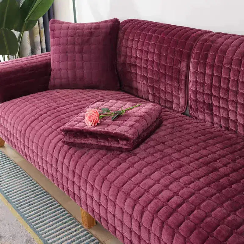 Maroon quilted velvet sofa cushion cover set with matching cushions on a plush living room sofa
