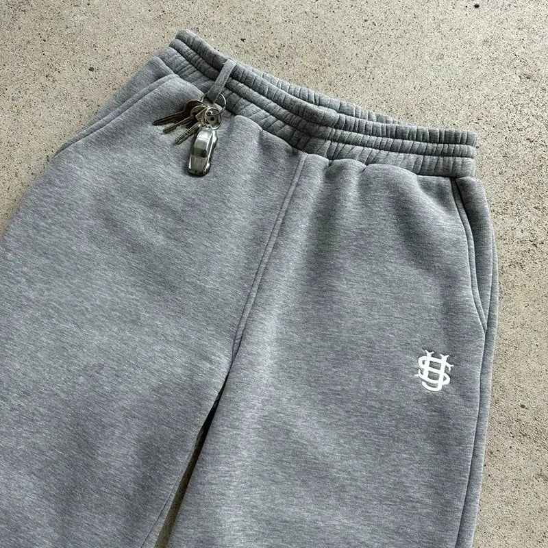 Sweatpants, grey with Simples Market logo, elastic waistband and side pockets