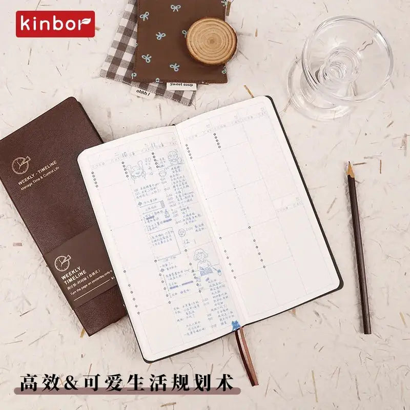 Kinbor weekly planner notebook by Simples Market; brown leatherette cover with open weekly layout on pages