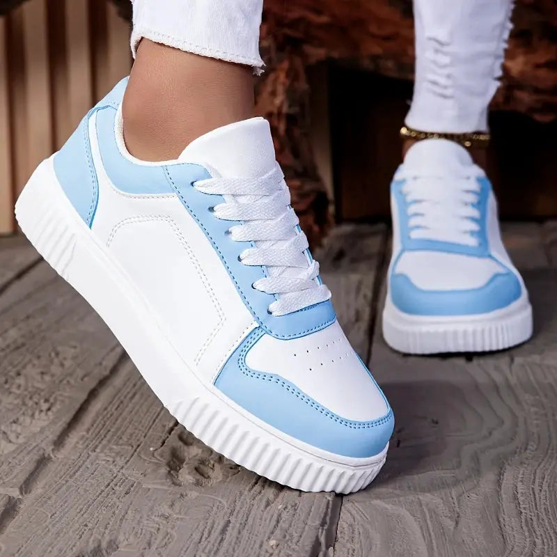 Pair of MAEDEF women's lace-up sneakers in white and light blue by Simples Market