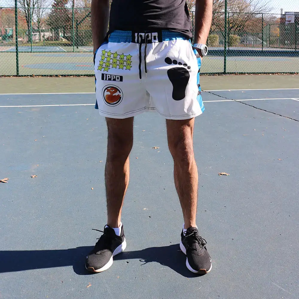 Hajime no Ippo shorts by Simples Market; white quick-dry gym shorts with blue side panels and IPPO logo.