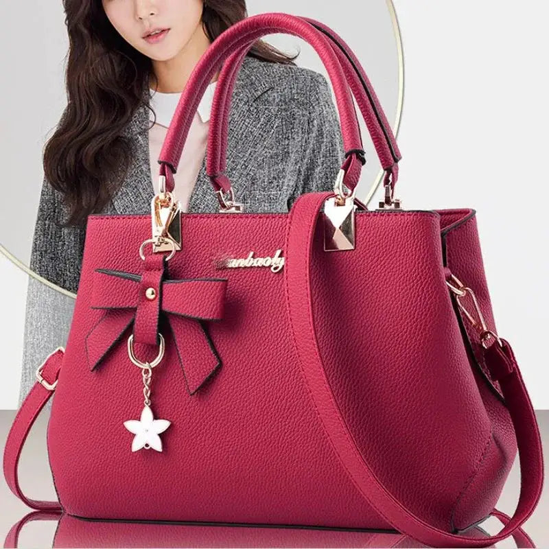 Pink shoulder bag with bowknot, gold hardware, and star charm from Simples Market