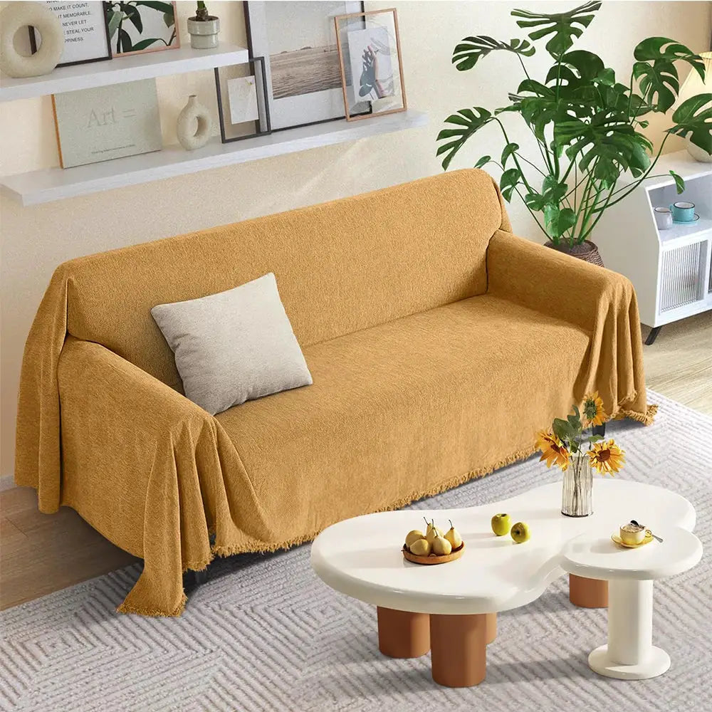 Couch cover by Simples Market in mustard chenille with fringe on a sofa