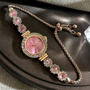 Watch: women's pink-dial quartz timepiece with rhinestone flower bracelet, gold-tone by Simples Market
