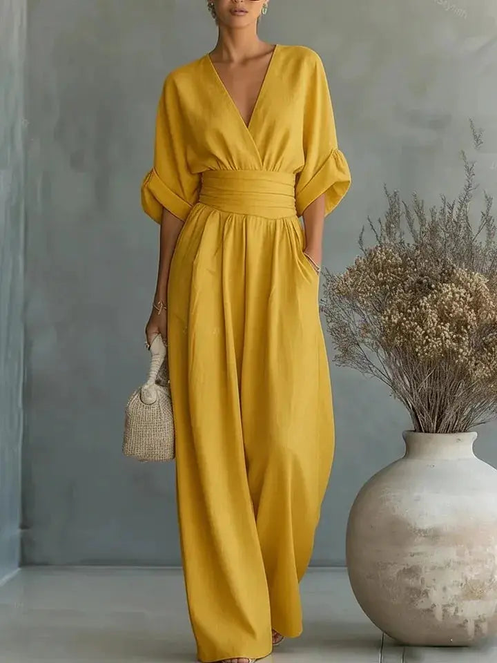 Waist V-neck Jumpsuit by Simples Market in solid mustard yellow with wide-leg, mid-sleeve.
