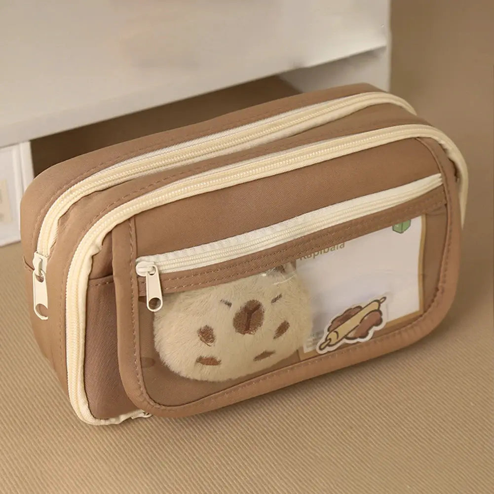 Capybara cute backpack with pencil case, tan color, clear front pocket featuring plush capybara.