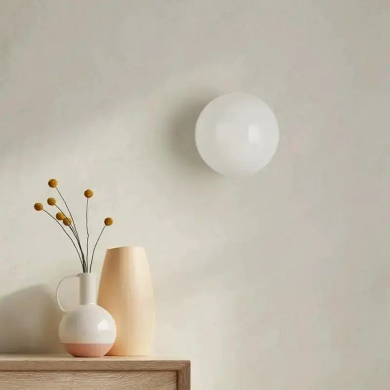 Milky white glass ball wall lamp; round frosted globe mounted on wall for living room, bedroom or hallway.