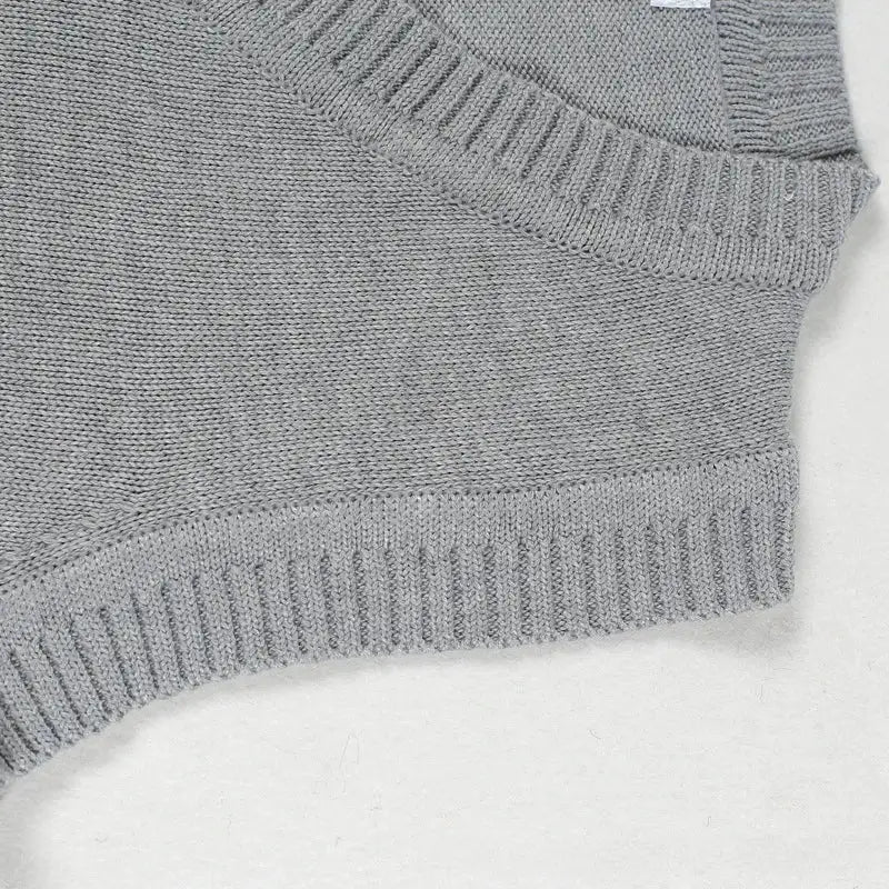 Men's gray knitted sweater vest with thick ribbed hem and V-neck