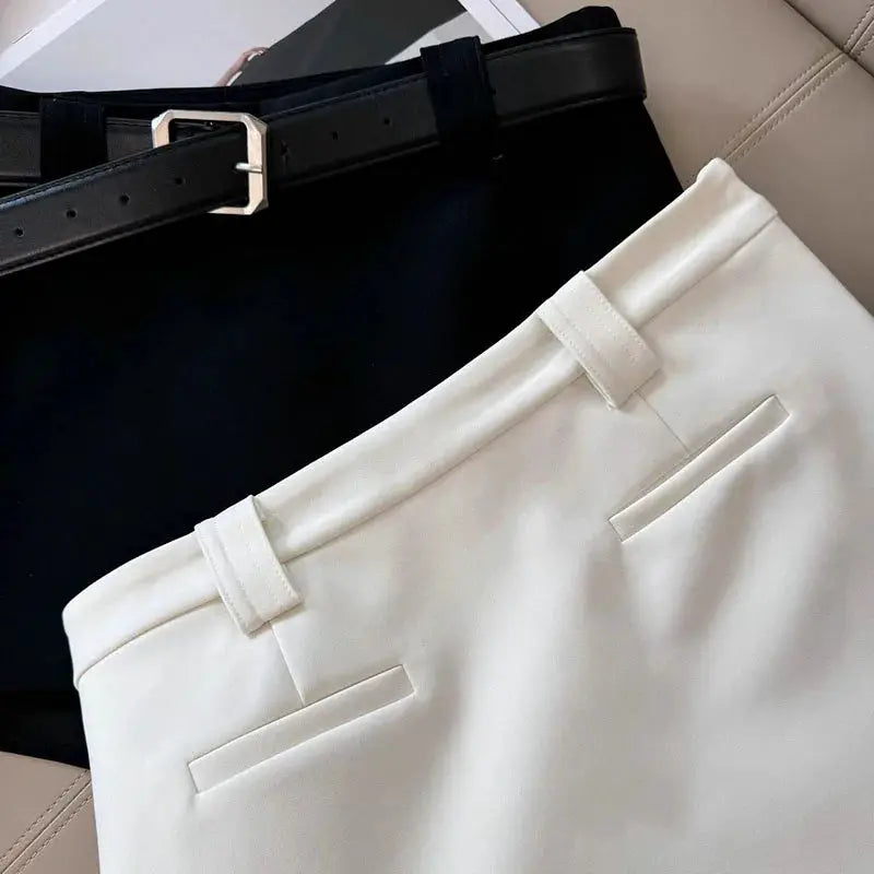 Simples Market white A-line office skirt with belt loops and belt; black skirt shown behind