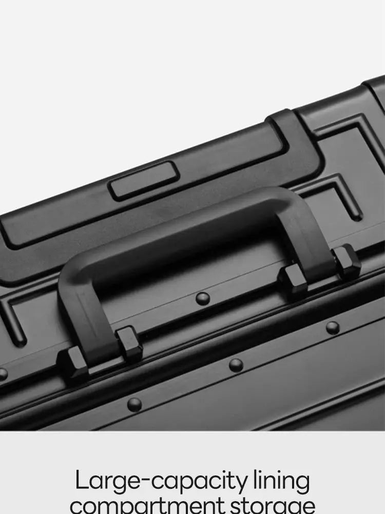 Simples Market aluminum-magnesium alloy travel suitcase with black hard-shell exterior and top handle.