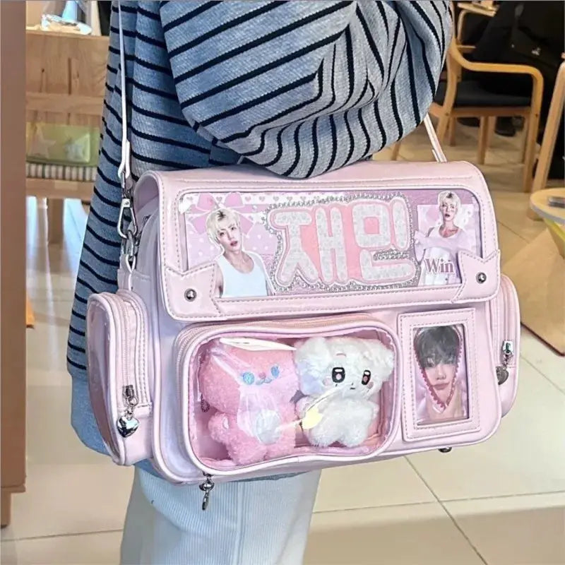 Pink faux-leather Harajuku-style square backpack with anime graphics and clear front pocket