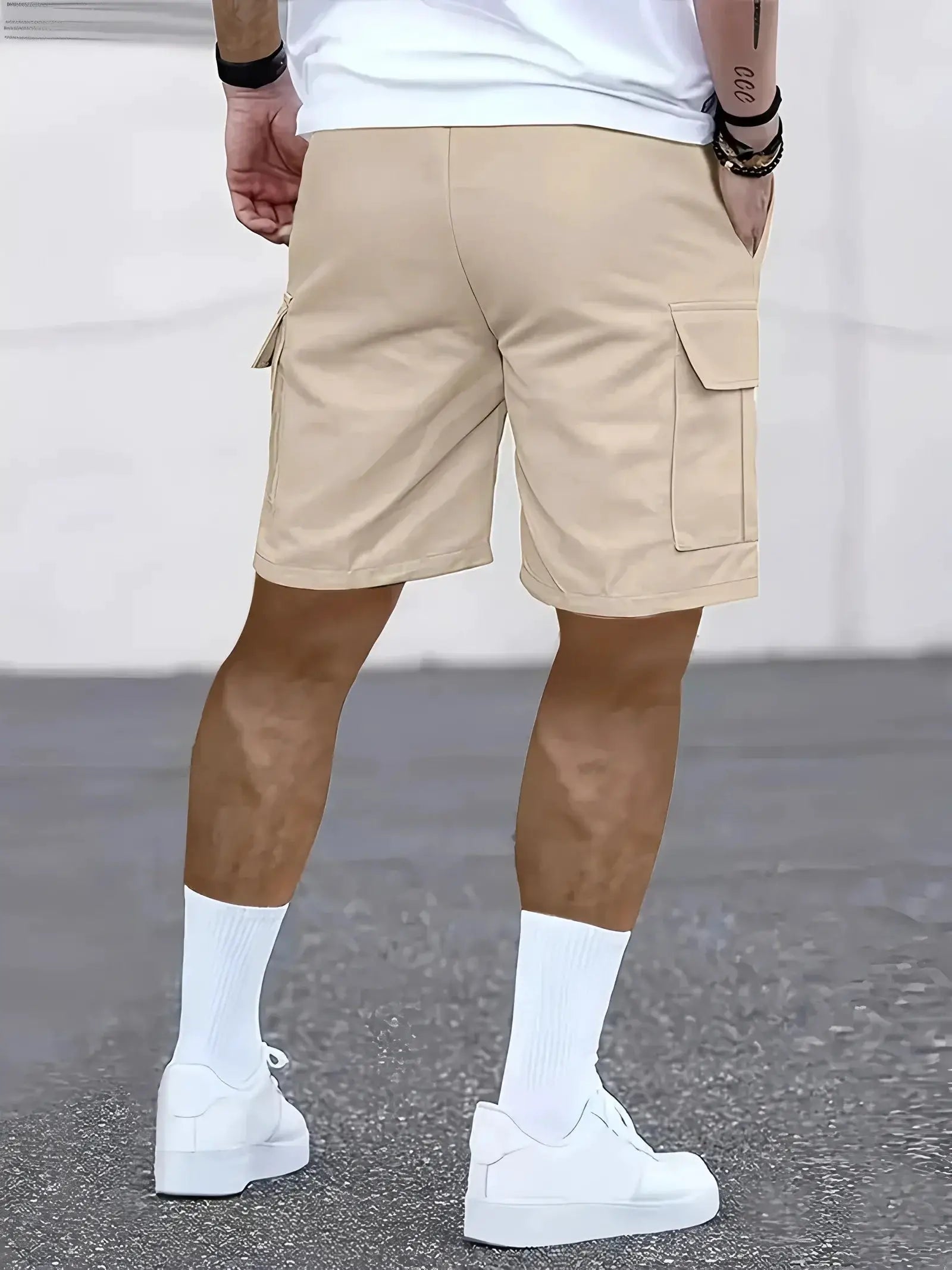 Men's work shorts in beige with multiple cargo pockets.