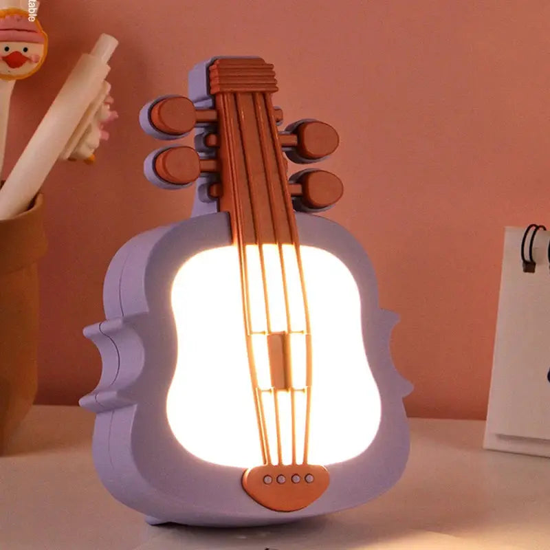 Simples Market TV Painting Night Light, purple guitar-shaped desk lamp with warm white LED glow