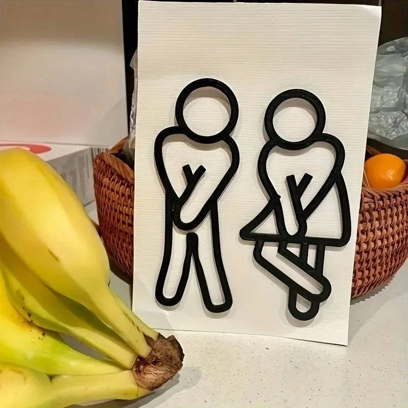 Funny bathroom signs wall sticker featuring 2D black male and female icons on a white panel
